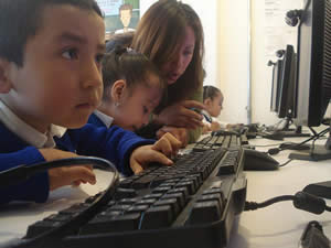 kids looking to computer screen