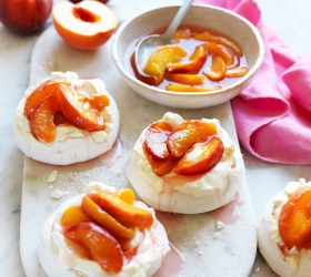 Mini pavlovas with poached peaches