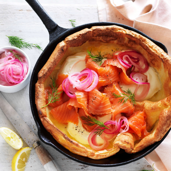Smoked salmon Dutch Baby recipe with cream and pickled onion